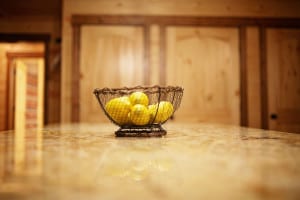 Cabin kitchen with breakfast bar/island with bowl of lemons