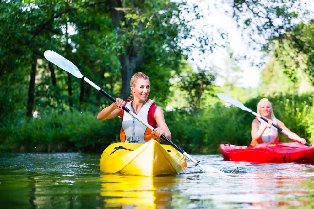 Photo of Two Women Trying Broken Bow Kayaking on the Lower Mountain Fork.