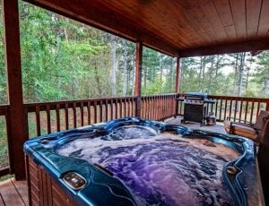 Photo of an Outdoor Hot Tub at One of Our Broken Bow Honeymoon Cabins.