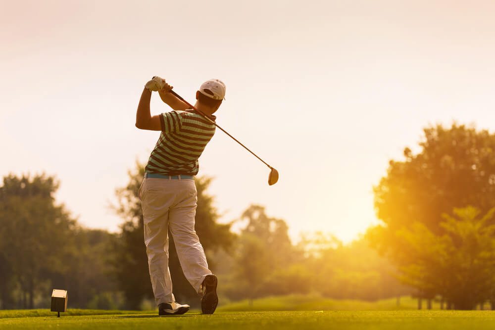 Man teeing off at one of two golf courses near Broken Bow, OK