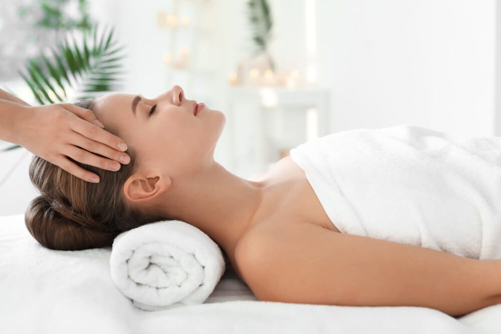 A woman getting a massage at one of the best spas in Broken Bow, OK